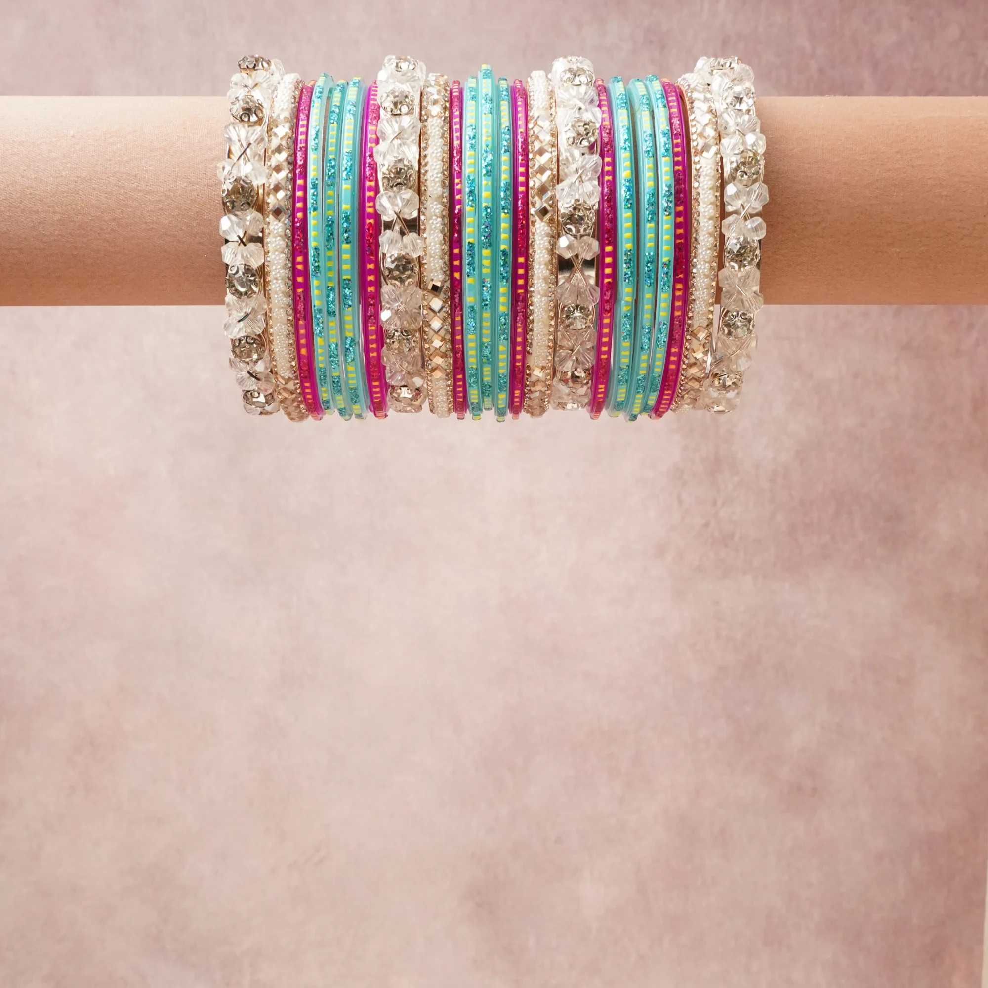 A grounding Teal forms the heart of the set, while touches of Lime Yellow, Silver, Iridescent White add charm.

A thoughtful composition of Acrylic, Lacquered Metal, Imitation Pearl, Costume Metal Alloy, Glitter, designed to feel complete without being heavy.
Each element layers seamlessly, creating a look that is refined, wearable and quietly striking.